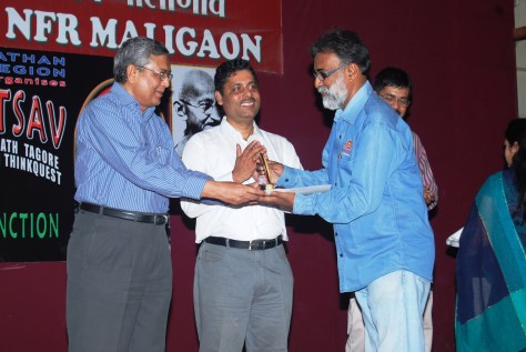 Receiving the trophy and Certificate of Appreciation from Shri A.K.Vajpayee, Assistant Commissioner Kendriya Vidyalaya Sangathan, Regional Office Guwahati on 19 April 2011, for being the Co-ordinator (Book Review), KVS Tagore Mahotsav.